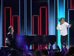 FILE - In this March 12, 2016, file photo, Charlie Puth, left, and Wiz Khalifa perform at the Kids&#039; Choice Awards at The Forum in Inglewood, Calif. Wiz Khalifa‚Äôs video for ‚ÄúSee You Again‚Äù featuring Puth is now the site‚Äôs most-watched video ever, with more than 2.896 billion views Tuesday, July 11, 2017. (Photo by Matt Sayles/Invision/AP, File)