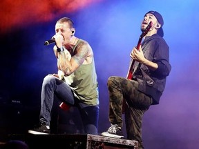 FILE - In this Aug. 15, 2014, file photo, Chester Bennington, left, and Mike Shinoda of the band Linkin Park perform in concert during their &ampquot;Carnivores Tour 2014&ampquot; at the Susquehanna Bank Center in Camden, N.J. Billboard said July 23, 2017, that the band&#039;s albums have returned to its album charts following Bennington&#039;s July 21 death. (Photo by Owen Sweeney/Invision/AP, File)