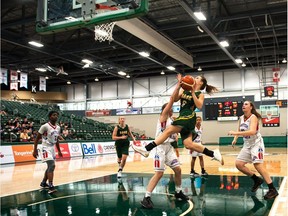 Team Saskatchewan's Cara Misskey flies high while attempting a basket against British Columbia during the girls bronze-medal game Saturday at the Canadian under-15 basketball championships.