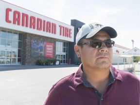 Kamao Cappo stands in the parking lot at the east Canadian Tire. While shopping at the store on July 26, 2017, he says he was racially profiled and accused of stealing.