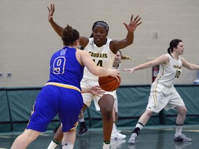 Angela Bongomin of the University of Regina Cougars, shown in this file photo defending against a member of the Lethbridge Pronghorns, helped Canada win a bronze medal Sunday at the FIBA women's basketball U19 World Cup in Italy.