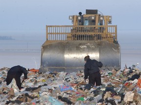 Members of the Regina Police Service search the city landfill on Jan. 3, 2003 for the body of a missing Regina man, Jaroslav "Joe" Heindl. He has never been located.