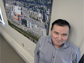 REGINA, SASK  : December  20  2013  --Mark Allan with an aeral photo of Evraz Place in Regina Friday December 20 2013.  BRYAN SCHLOSSER/Regina, Leader-Post.
Bryan Schlosser, Regina Leader-Post