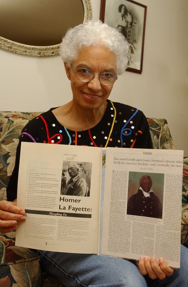 Carol LaFayette-Boyd shows two news clipping of LaFayette family members. One is her Uncle, Saskatchewan farmer Homer LaFayette (left) and the other James Armistead LaFayette who was a spy for General George Washington in the siege of Yorktown in 1781.