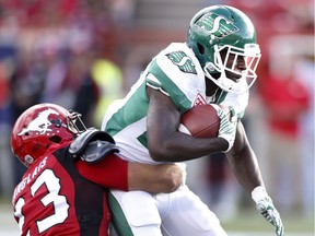 Saskatchewan Roughriders' Greg Morris, right, is tackled by Calgary Stampeders' William Langlais during first half CFL football action in Calgary on Saturday July 22, 2017. THE CANADIAN PRESS/Larry MacDougal ORG XMIT: LMD104
Larry MacDougal,