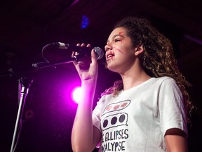 Rosie Hess fronts the band The Ellipses Apocalyspe during their performance at the Girls Rock camp showcase at the Exchange in Regina, Saskatchewan on July 29, 2017.