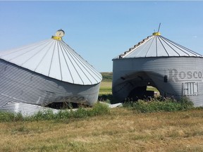 The RCMP in Indian Head in southern Saskatchewan believe a vehicle smashed into one grain bin on a local farm and drove right through another sometime between July 26 and July 29, 2017. Submitted photo.