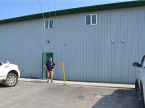 Artist Josh Goff stands in front of a wall at the La Loche Friendship Centre. Goff is currently in La Loche helping to paint a mural on the wall through the Saskatchewan Cultural Exchange. SUBMITTED PHOTO