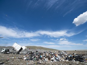 A garbage truck unloads a load of garbage at the City of Regina Landfill in Regina.