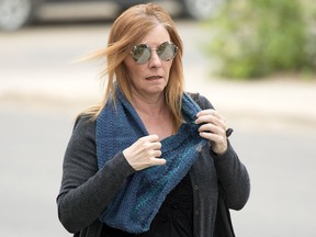 Alena Pastuch, accused of defrauding investors of $5.6 million, arrives at Court of Queens Bench on July 11, 2017.