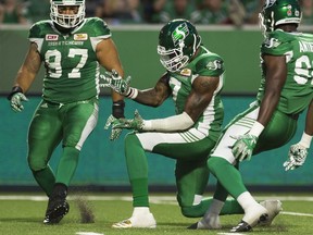 Defensive end Willie Jefferson, shown celebrating a sack on Saturday, helped the Saskatchewan Roughriders create consistent pressure on Hamilton Tiger-Cats quarterback Zach Collaros.