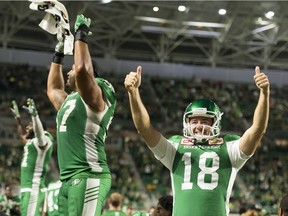 Saskatchewan Roughriders punter Josh Bartel, 18, and his teammates salute the crowd Saturday after a 37-20 CFL victory over the Hamilton Tiger-Cats at Mosaic Stadium.