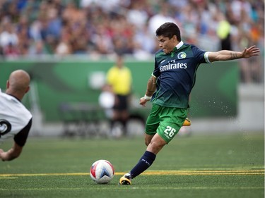 The New York Cosmos played the Valencia CF played as part of Soccer Day in Saskatchewan at Mosaic Stadium in Regina.  Cosmos' Eric Calvillo boots the ball past the keeper for the first goal of the game.