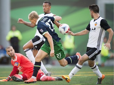 The New York Cosmos played the Valencia CF played as part of Soccer Day in Saskatchewan at Mosaic Stadium in Regina.  Cosmos' Eugene Stariov #27 can't get the ball past Valencia CF keeper Jaume Domenech.