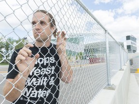 Joe van Heerden, general manager at District Brewing Company, stands behind a fence near the dry dock at Mosaic Stadium. The Saskatchewan Craft Brewers Association have been informed that craft beer will not be sold at the stadium in 2017.