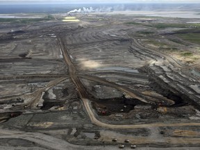 Aerial view of the Syncrude plant, mine pit and tailings ponds and green reclamation areas at Fort McMurray, Alta, June 8, 2010.