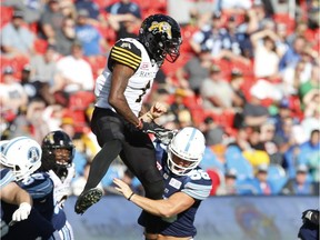 Hamilton Tiger Cats Will Hill III DB (1) goes up to try and block a field goal against Toronto Argonauts Jake Reinhart LB (58) during the fourth quarter in Toronto, Ont. on Sunday June 25, 2017.