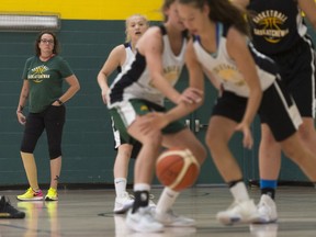 Assistant coach Tracy Johnson, left, observes Saskatchewan's under-15 girls during a practice at the University of Regina.