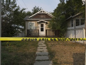 Police tape blocks off a yard in the 1078 Argyle St.
