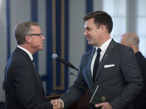 REGINA, SASK : August 30, 2017 - Steven Bonk, right, shakes Brad Wall's hand at a cabinet shuffle at Government House. Bonk became minister of economy and minister responsible for Tourism Saskatchewan, Innovation and Trade. MICHAEL BELL / Regina Leader-Post.
Michael Bell, Regina Leader-Post