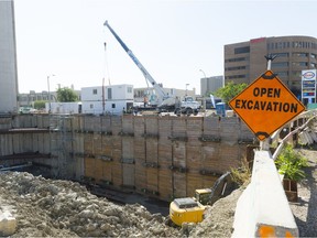 Crews work at the Capital Pointe construction site.