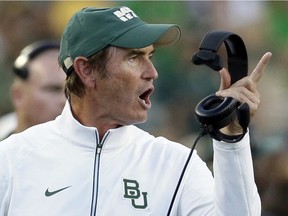 In this Sept. 12, 2015, file photo, Baylor coach Art Briles yells from the sideline during the first half of an NCAA college football game against Lamar in Waco, Texas. The Hamilton Tiger-Cats of the Canadian Football League have hired former Baylor coach Art Briles to be an assistant. The team announced the move Monday, Aug. 28, 2017, via Twitter.