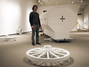 Brett Graham, a Maori artist from New Zealand, helped reconstruct his piece Pioneer at the MacKenzie Art Gallery on Monday.