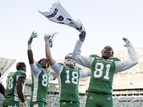Saskatchewan Roughriders wide receiver Duron Carter  (89) from left, punter Josh Bartel (18) and 
 wide receiver Bakari Grant (81) get the crowd into the action in second half CFL action at Mosaic Stadium on Saturday, July 29, 2017.  The Roughriders won 38-27.