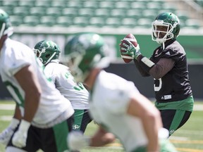 Saskatchewan Roughriders quarterback Kevin Glenn  (5) takes the snap during practice in Regina.