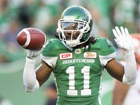 The Roughriders' Ed Gainey celebrates one of his franchise-record four interceptions on Sunday during a 41-8 victory over the visiting B.C. Lions.