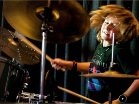 11-year-old drummer Taylor Miles performs with School of Rock Calgary's house band during an open house at School of Rock in Regina, Saskatchewan on Aug 12, 2017.