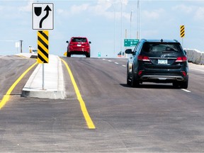 Vehicles drive across the newly opened overpass at White City near Regina, Saskatchewan on August 12, 2017.
