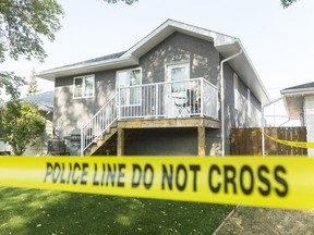 Police tape blocks off a residence at 207 Angus St.