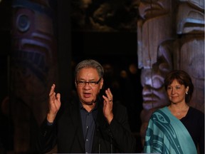 Premier Christy Clark looks on as Grand Chief Ed John speaks about an important announcement regarding ancestral remains and belongings of cultural significance during a ceremony at the Royal B.C. Museum in Victoria, B.C., Tuesday, June 21, 2016. John had released a report in late 2016 that called for an overhaul of aboriginal child welfare systems