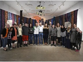 Deaf Crows, a group of deaf and hard of hearing students at Thom Collegiate, pose for a group shot at the Dunlop Art Gallery along with their teachers and artists-in-residence.