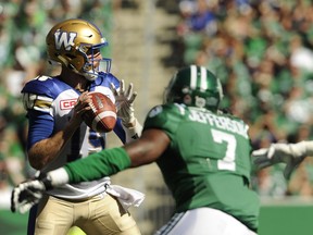 The Saskatchewan Roughriders' Willie Jefferson (7) zeroes in on Winnipeg Blue Bombers quarterback Matt Nichols on Sunday.