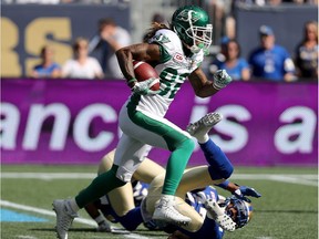 The Saskatchewan Roughriders' Naaman Roosevelt heads for the end zone Saturday after eluding the Winnipeg Blue Bombers' TJ Heath.