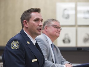 Layne Jackson, left, speaks about his selection as Fire Chief for Regina Fire and Protective Services.