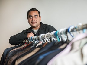 Harris Khan, Vice President of External Affairs for the University of Regina's Student Union, poses for a photograph in his office where he is storing suits to be given out to students as part of the new URSU Threads program.