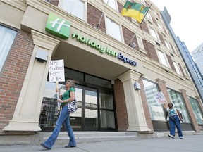 Members of the union UNITE HERE strike line in front the Holiday Inn Express in Regina.