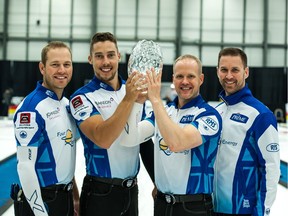 Team Gushue holds the men's tier 1 championship trophy Sunday at the Grand Slam of Curling's Tour Challenge, held at the Co-operators Centre.