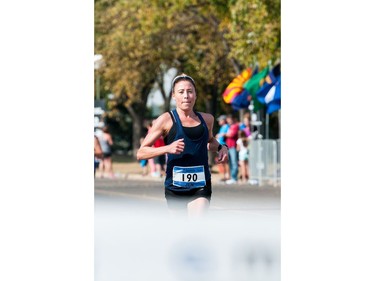 Jen Kripki, first place woman finisher in the full marathon portion of the Queen City Marathon, sprints the last hundred metres to cross the finish line in front of the Conexus Arts Centre in Regina, Saskatchewan on September 10, 2017.