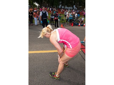A participant gasps for air after finishing the Queen City Marathon in Regina, Saskatchewan on September 10, 2017.