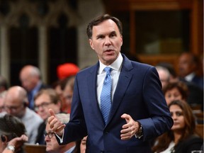 Minister of Finance Bill Morneau stands during Question Period in the House of Commons on Parliament Hill in Ottawa on Wednesday, Sept. 20, 2017.