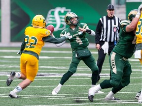 University of Regina Rams quarterback Noah Picton throws under pressure Saturday against the University of Alberta Golden Bears.