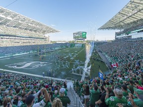 Saskatchewan Roughriders take the field at the Saskatchewan Roughriders' home opener at Mosaic Stadium.