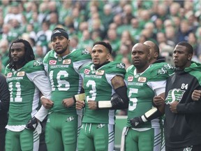 The Riders showed their support for their football-playing brothers in the United States by linking arms during Sunday's national anthem at Mosaic Stadium.