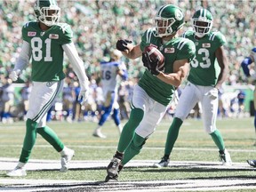 Rob Bagg scores one of the Saskatchewan Roughriders' four first-half touchdowns against the Winnipeg Blue Bombers on Sunday.