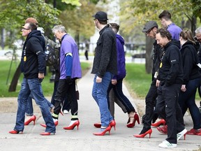 The inaugural YWCA's Walk A Mile in Her Shoes event, raising money awareness and funds for programs and services that support women and children affected by gender-based violence, was held over the noon hour in City Square Plaza Regina.