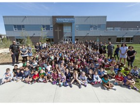 Staff and students posed for a photo on the first day of school ever at St. Kateri Tekakwitha School in Regina.